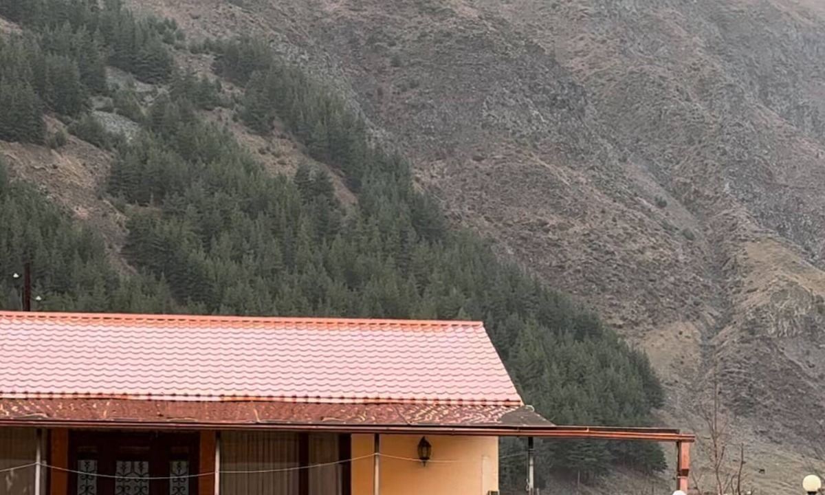 Kazbegi House | A Private Guest House in a secluded area by the river, surrounded by mountains.