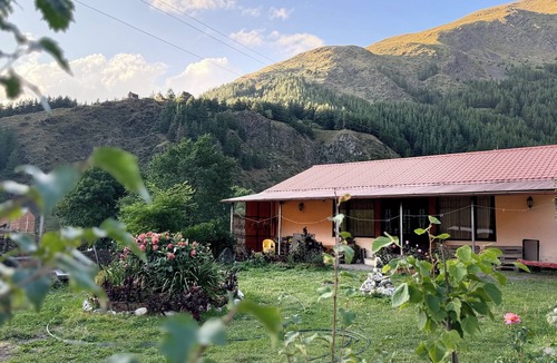 Kazbegi House | A Private Guest House in a secluded area by the river, surrounded by mountains.