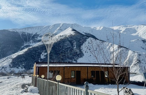 Kazbegi Apartment | A studio apartment at a secluded area by the river, surrounded by mountains.