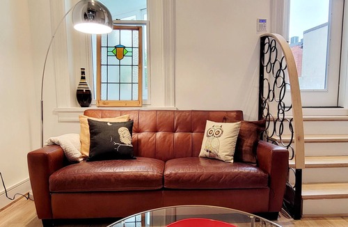 Logan Circle Apartment | Modern 2BR Treetop Oasis in Historic Home on Logan Circle.