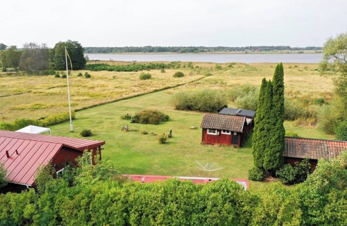 Vasteras Villa | Seaside plot with private jetty, rowing boat & sunset