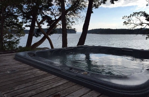 Roche Harbor House | Westcott Bay Beachfront Home - Hot Tub with a view of the Bay