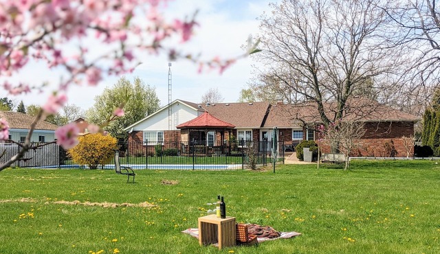 A poolside guest stay nested in a beautiful orchard along winery route in Niagara-on-the-Lake