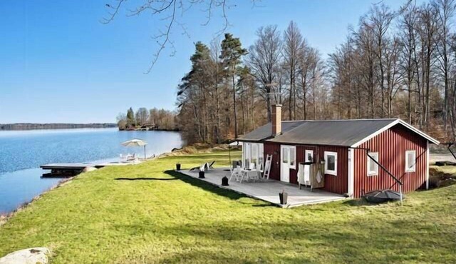 Cottage with beach plot, boat and jetty in Småland in Ör