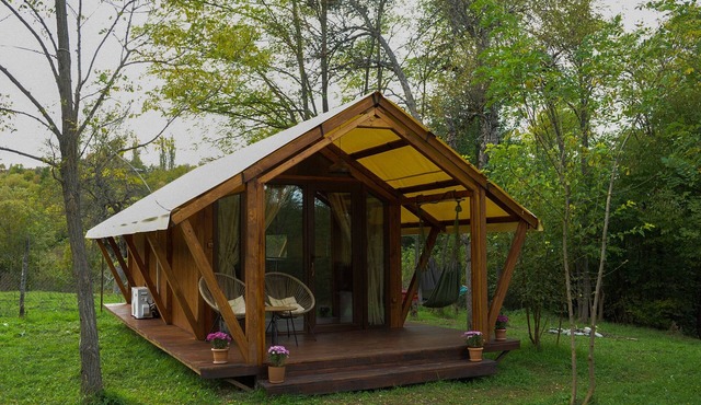 Cozy cottage in the middle of green garden, with mountain views.