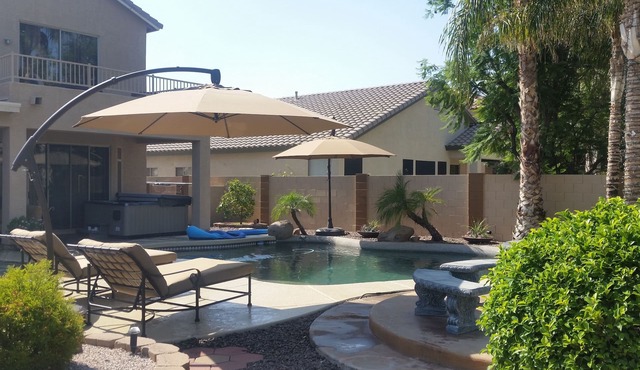 Great House with a jacuzzi, pool, outdoor fireplace & a large backyard! in Chandler