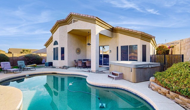 Inviting home with pool, hot tub, enclosed yard, fast WiFi, & W/D in Phoenix