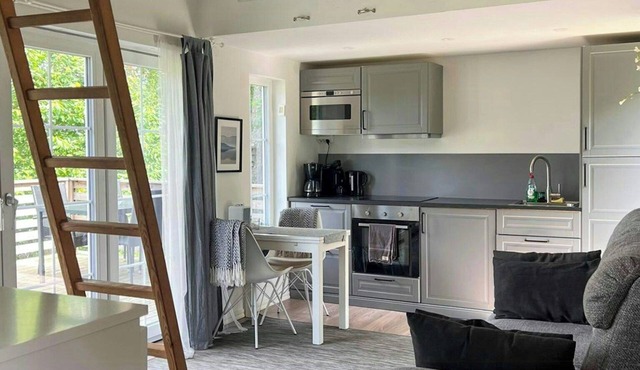 Mini house with sandy beach and sauna in Olofstorp