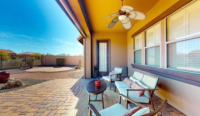 Single-level mountain view retreat with fenced yard, washer/dryer, & AC in Goodyear