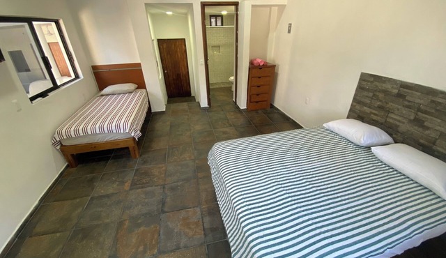 Very comfortable suite with 1 QS + 1 twin bed, AC. Only 2 blocks from beach. in Los Ayala